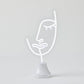 Face LED Neon Light on Stand by Pilbeam Living