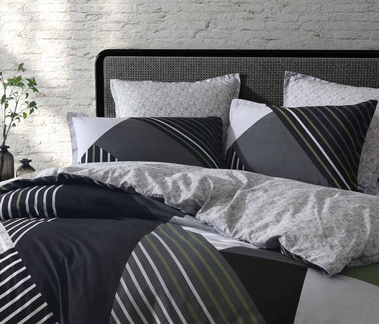 Noah Charcoal is a new colourway in a classic design. The design uses shades of grey to create an urban look and is highlighted by olive; an  SS23 seasonal colour. The reverse compliments the design in a monochromatic silver texture.